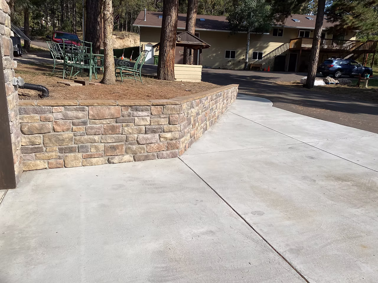 Stacked stone retaining wall and landscape masonry