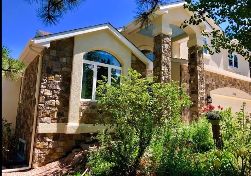 Custom Colorado home with stone veneer and masonry exterior