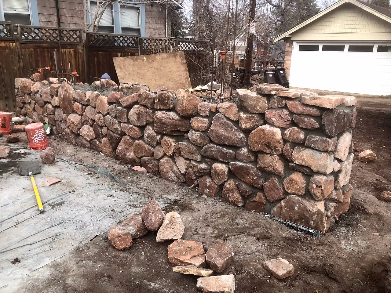 Stacked stone retaining wall and landscape masonry